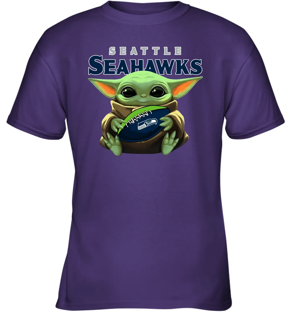 Baby Yoda Loves The Seattle Seahawks Star Wars Baby Yoda Hugs Seahawks NFL Youth T-Shirt